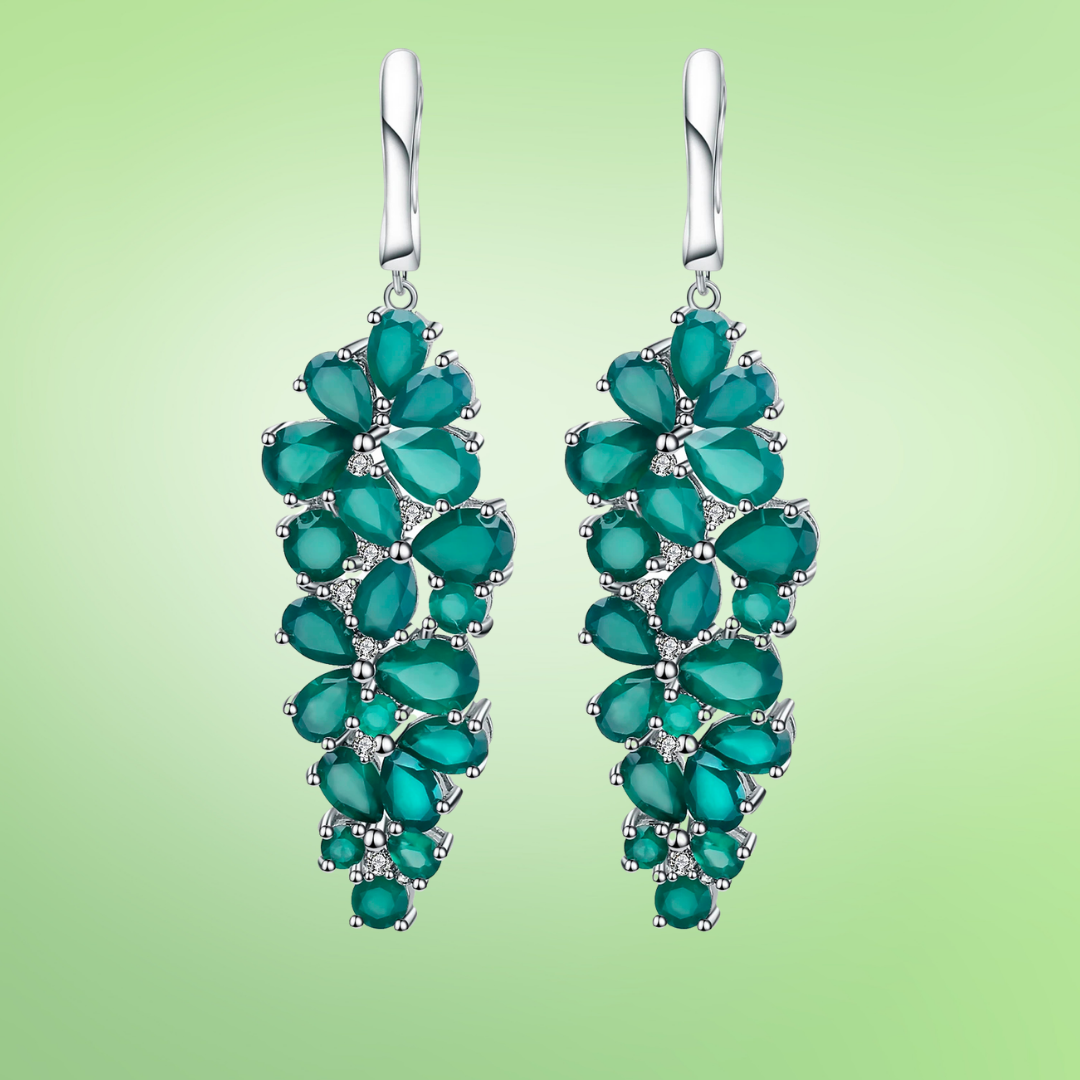 Dangling silver earrings with clustered green teardrop stones arranged in a cascading floral pattern

