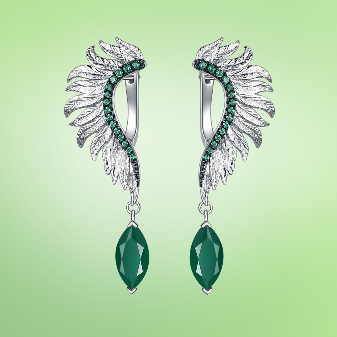Silver earrings with feather-like design, green gemstones, and marquise green dangles

