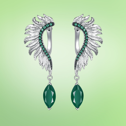 Silver earrings with feather-like design, green gemstones, and marquise green dangles


