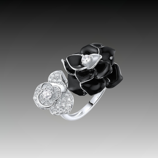 Black and white enamel floral ring with central clear stones in open bypass style

