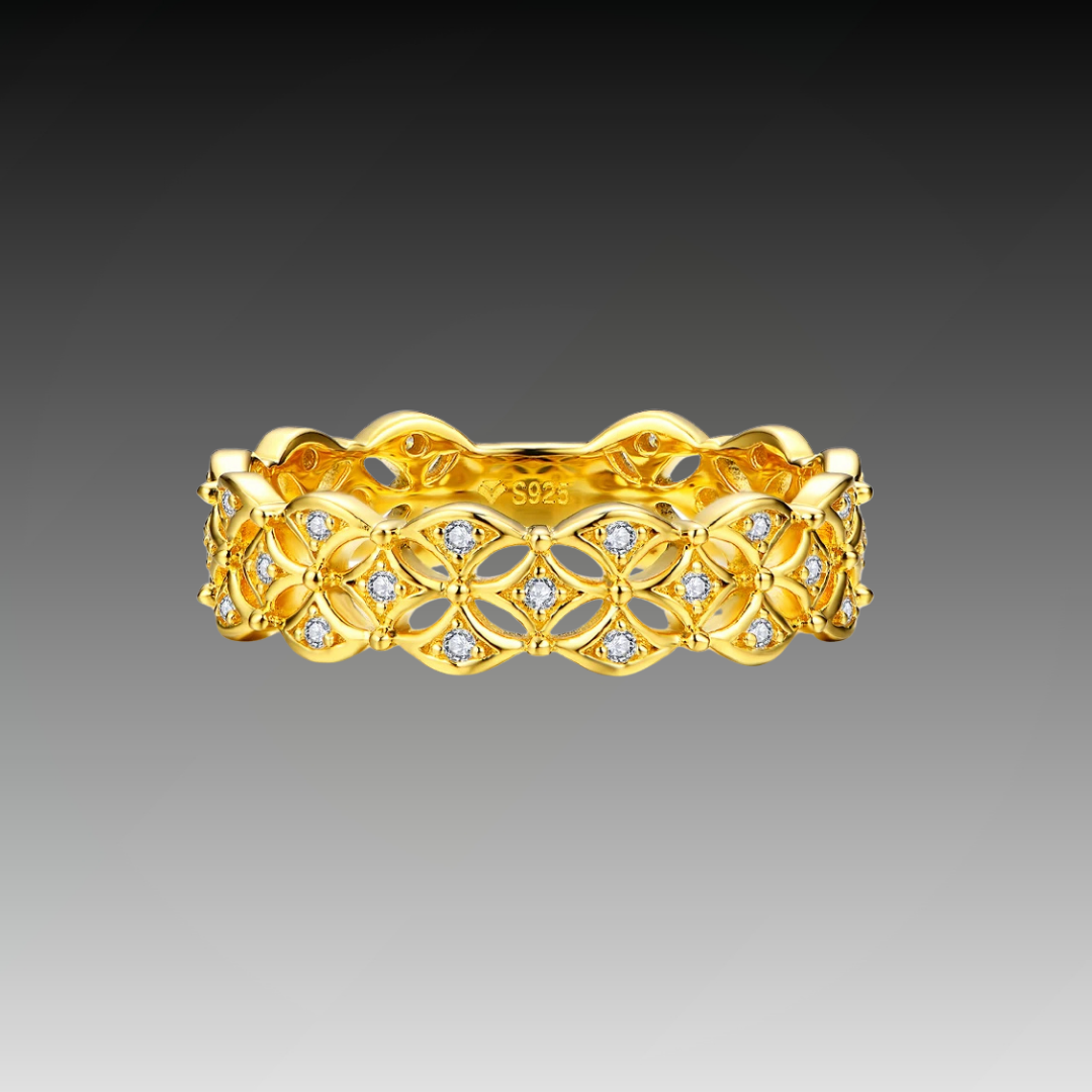 Gold-plated floral pattern ring featuring openwork petals set with small white stones throughout the band.

