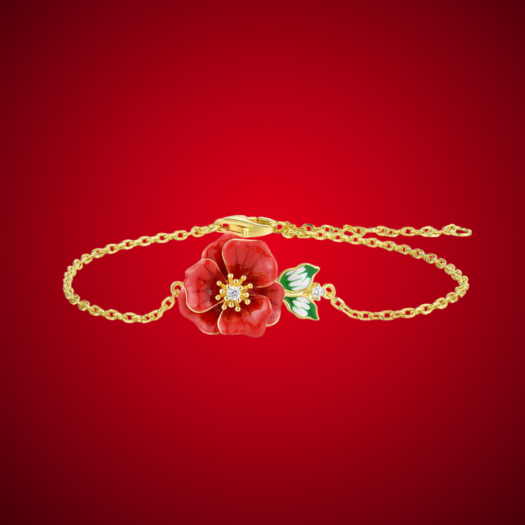 Delicate gold bracelet featuring a red enamel flower with a crystal center and green-and-white enamel leaves, Rosa Rossa from the Rossa Collection.

