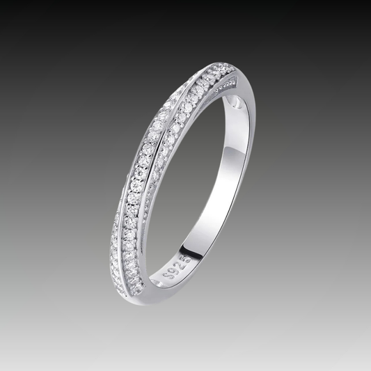 Slim silver ring featuring two parallel rows of small white stones, forming a subtle twist in the center, from the Bianco Nero collection.

