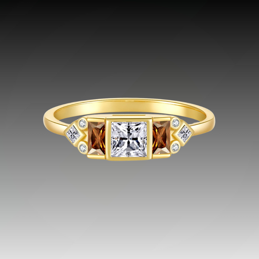 Gold ring with central white stone flanked by smoky square-cut stones and small accent gems

