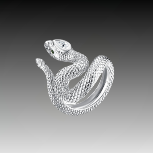 Textured silver snake ring coiled in a striking pose with green eyes and a marquise-cut clear stone set in the head.

