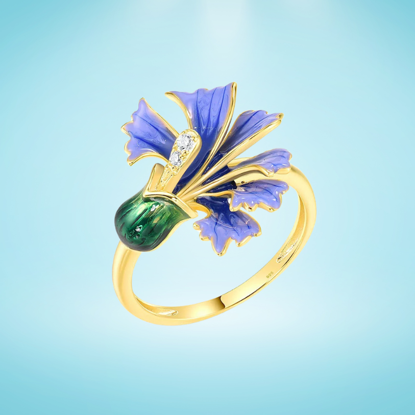 Gold ring with a violet enamel flower and green enamel bud, accented with small clear stones

