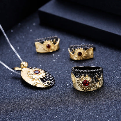 Coordinated necklace, earrings, and ring set with gold sunflower design and purple gemstones

