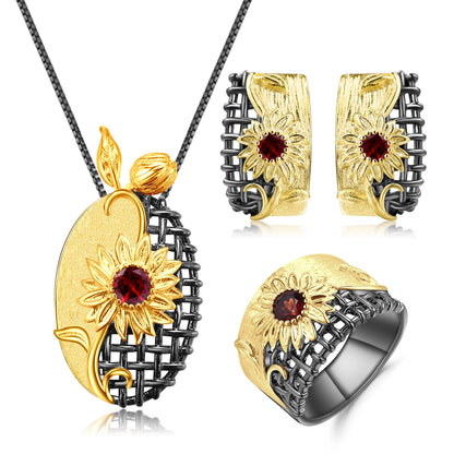 Coordinated necklace, earrings, and ring set with gold sunflower design and purple gemstones

