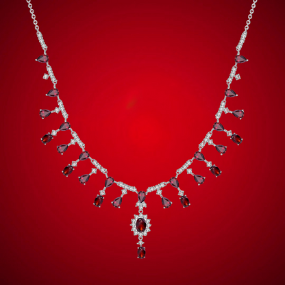 Elegant necklace with red gemstones and diamonds on a red background