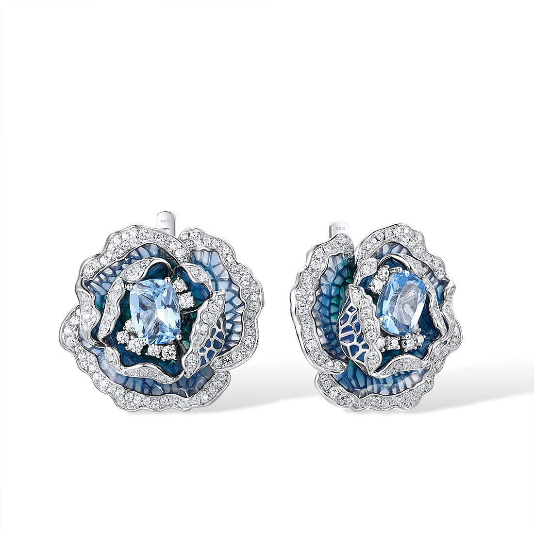 Silver and blue enamel rose-shaped earrings with layered petals and central light blue gemstones

