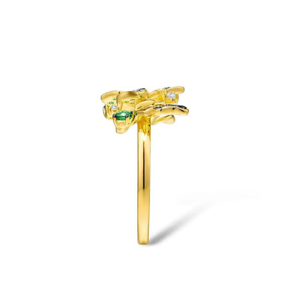 Gold butterfly ring adorned with green crystals and delicate flower accents

