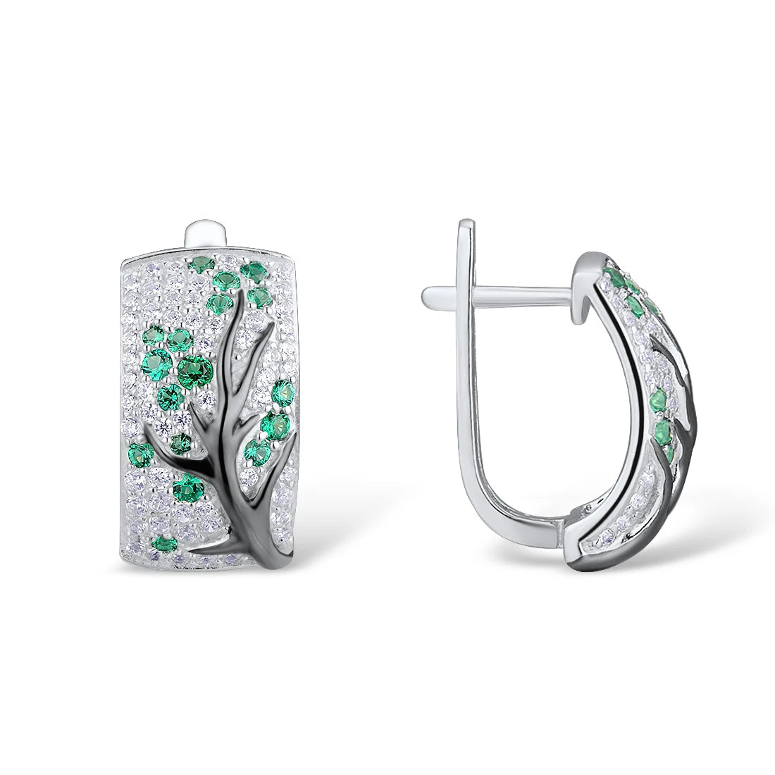 Silver earrings with raised black tree branches and scattered green and white stones

