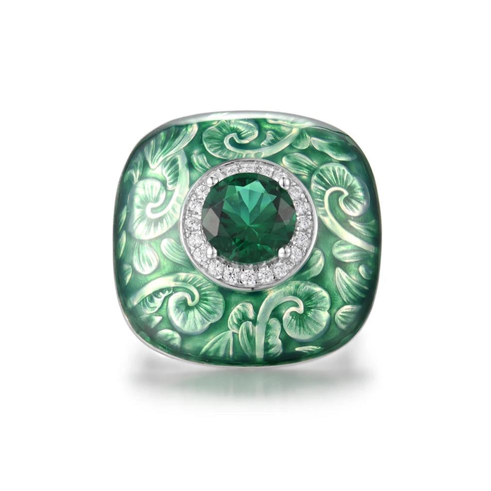 Square green enamel ring with engraved floral design and central green gemstone

