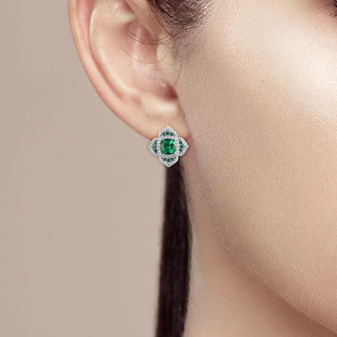 Cushion-cut green gemstone earrings with layered silver and green pavé accents

