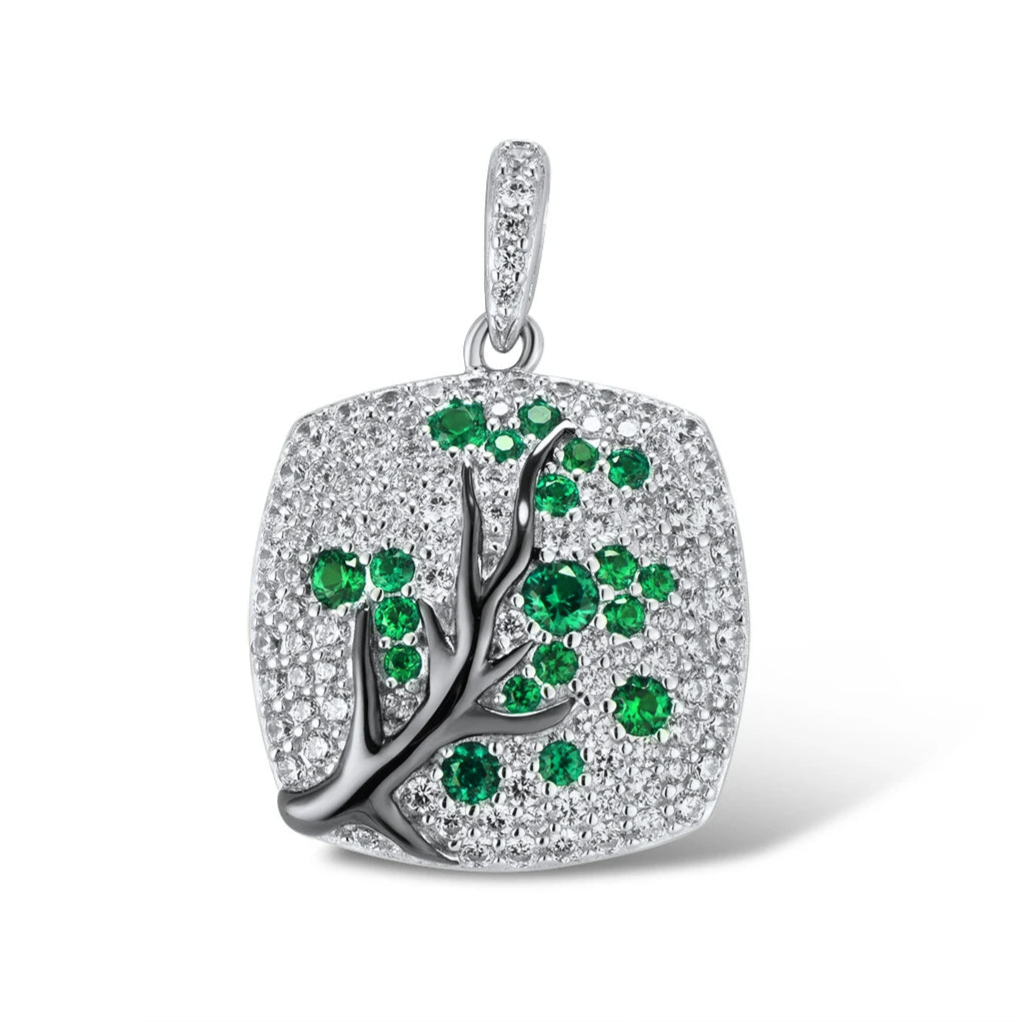 Silver square pendant featuring a black tree branch design with green gemstone leaves

