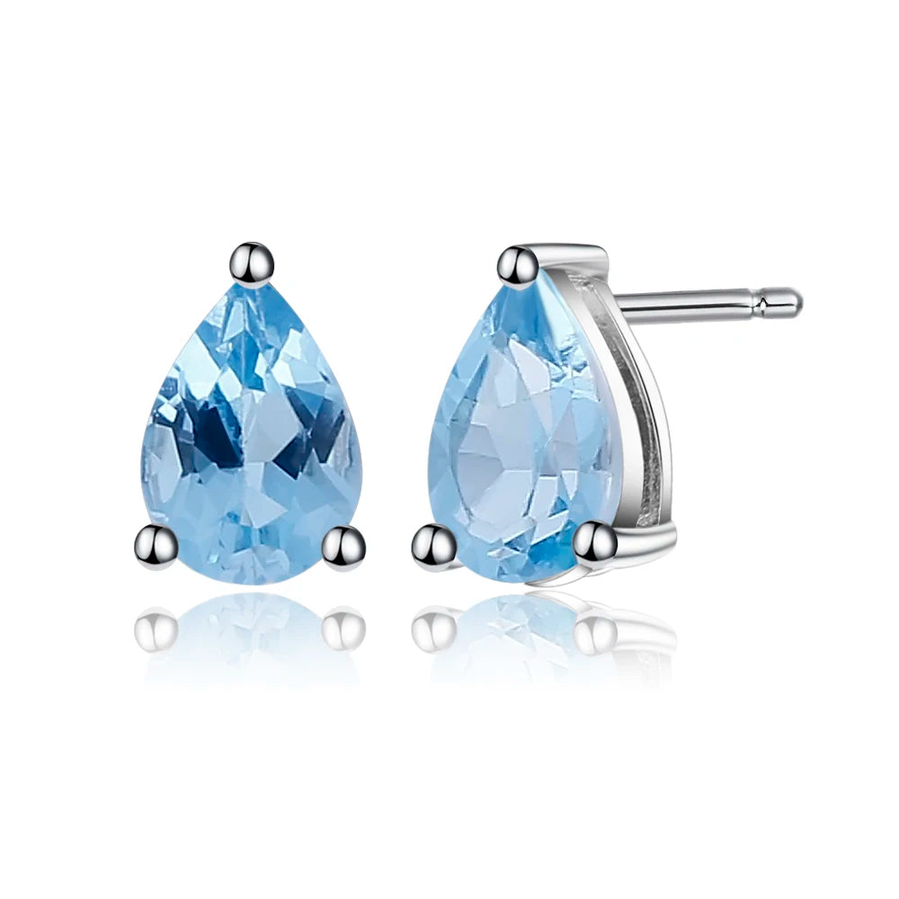 Sterling silver stud earrings with pear-shaped blue topaz gemstones in a three-prong setting

