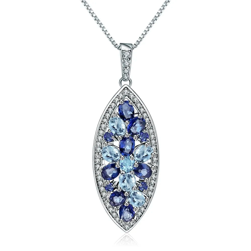Marquise-shaped silver pendant with a floral arrangement of light and dark blue gemstones

