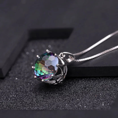 Silver pendant with a round multicoloured quartz stone in a scalloped prong setting

