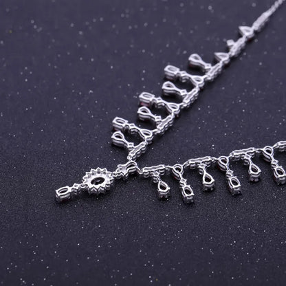Necklace with red gemstones and clear stones on a black background