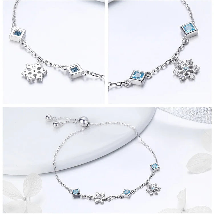 Delicate silver adjustable bracelet with blue square-cut stones and snowflake charms

