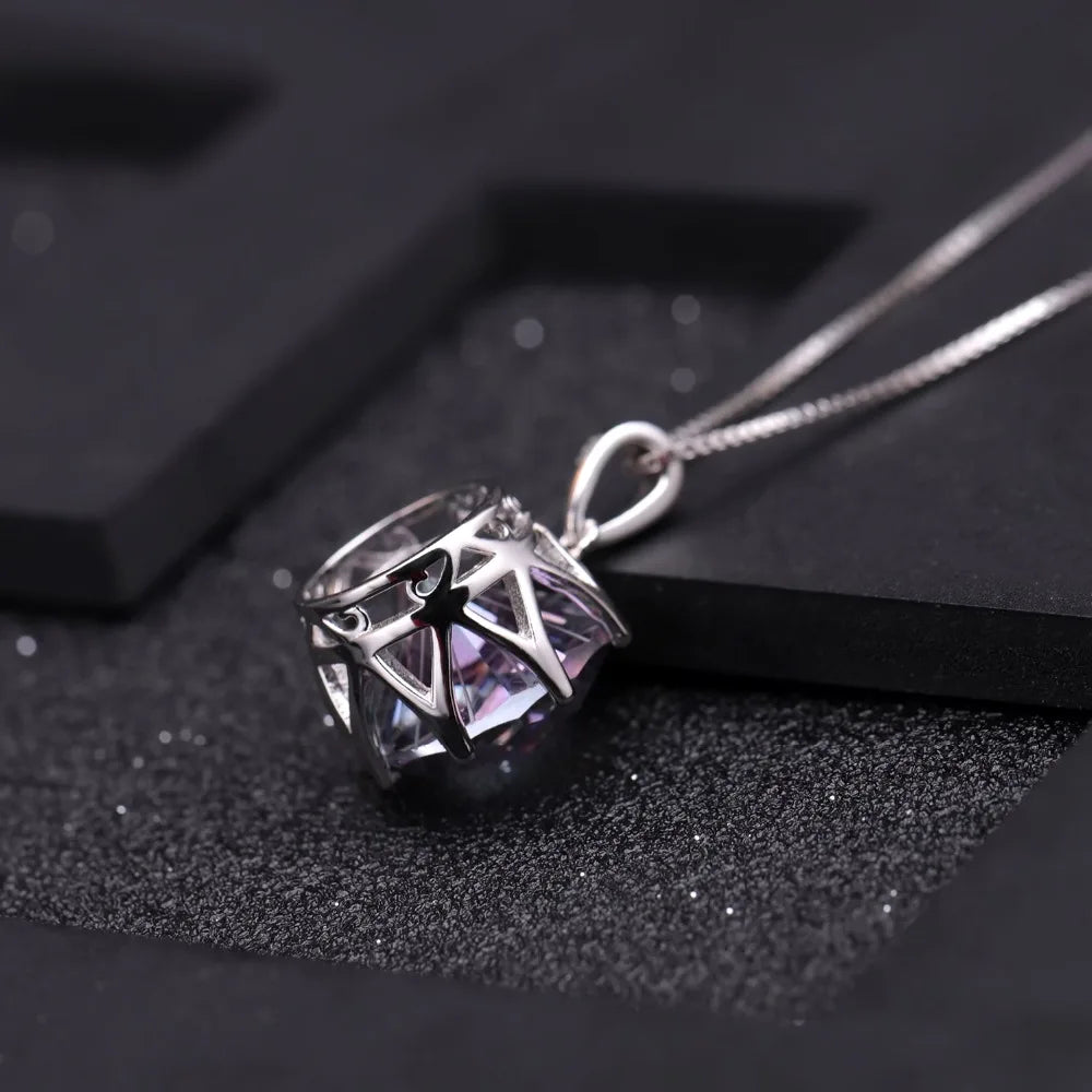 Silver pendant with a round multicoloured quartz stone in a scalloped prong setting

