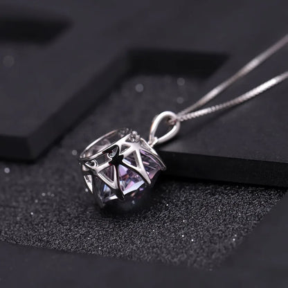 Silver pendant with a round multicoloured quartz stone in a scalloped prong setting

