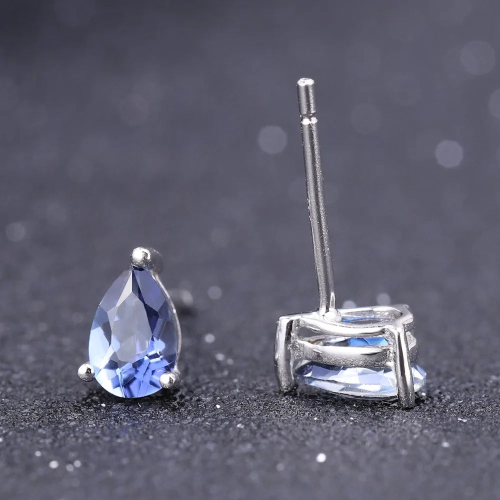 Silver stud earrings with deep blue teardrop-shaped quartz stones

