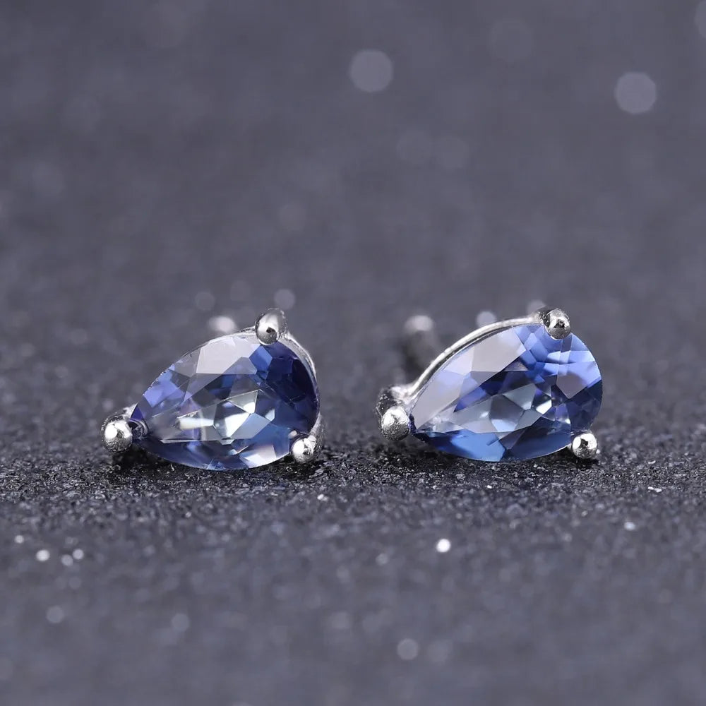 Silver stud earrings with deep blue teardrop-shaped quartz stones

