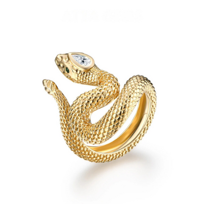 Textured silver snake ring coiled in a striking pose with green eyes and a marquise-cut clear stone set in the head.

