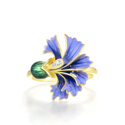 Gold ring with a violet enamel flower and green enamel bud, accented with small clear stones


