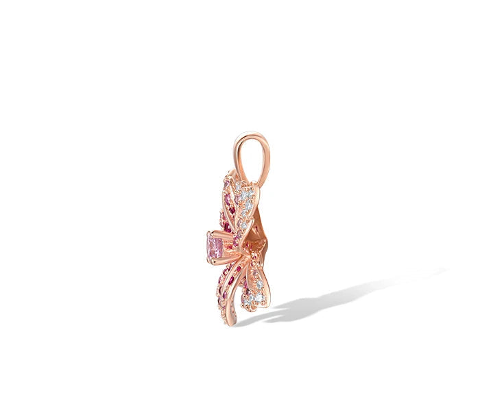 Giglio Rosa jewelry set featuring flower-shaped rose gold pieces with pink and white pavé stones, including ring, earrings, and pendant.


