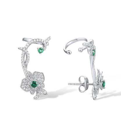 Floral vine-inspired earrings with sparkling white pavé and green gemstone accents

