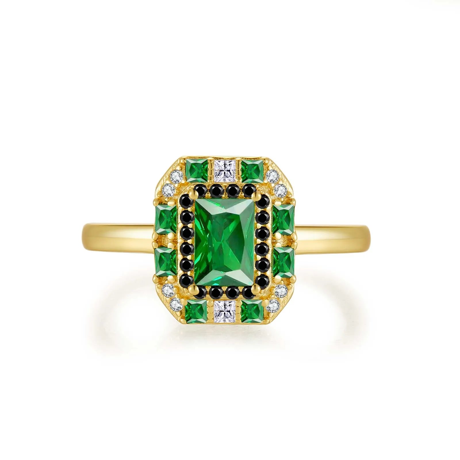 Gold ring with a central emerald-green rectangular stone, surrounded by alternating black and white crystals and square-cut green gems.


