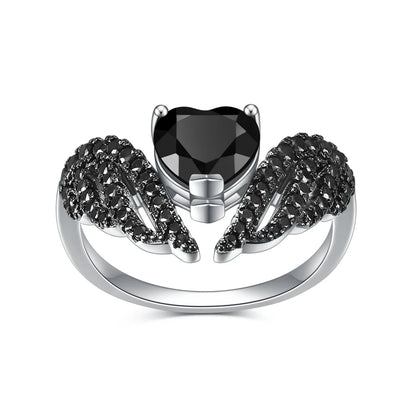 Sterling silver ring with a heart-shaped black gemstone flanked by pavé-set wing-like details, from the Ali Nere design.

