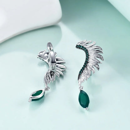 Silver earrings with feather-like design, green gemstones, and marquise green dangles

