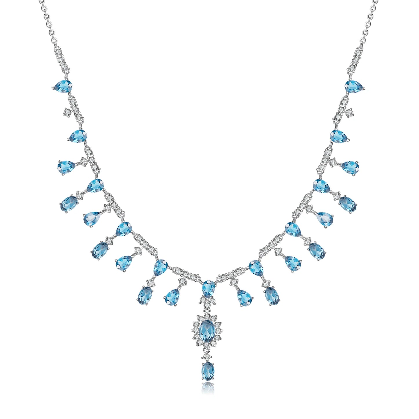 A silver necklace featuring green garnet stones set in an oval pattern with additional small white stones on a link chain.