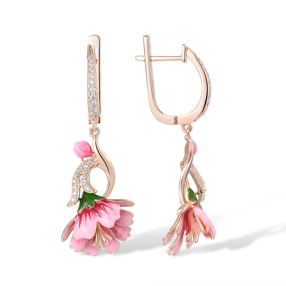 Fiore Pressato earrings shaped like delicate pink bell flowers, accented with green and gold enamel and sparkling stones.

