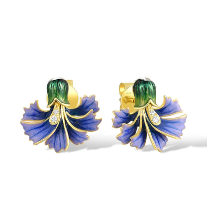 Gold-plated stud earrings with hand-painted purple and green enamel floral design and small crystal accents

