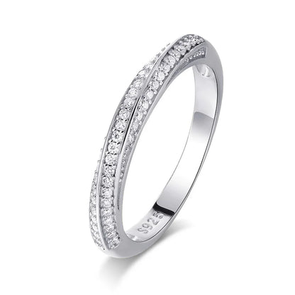 Slim silver ring featuring two parallel rows of small white stones, forming a subtle twist in the center, from the Bianco Nero collection.

