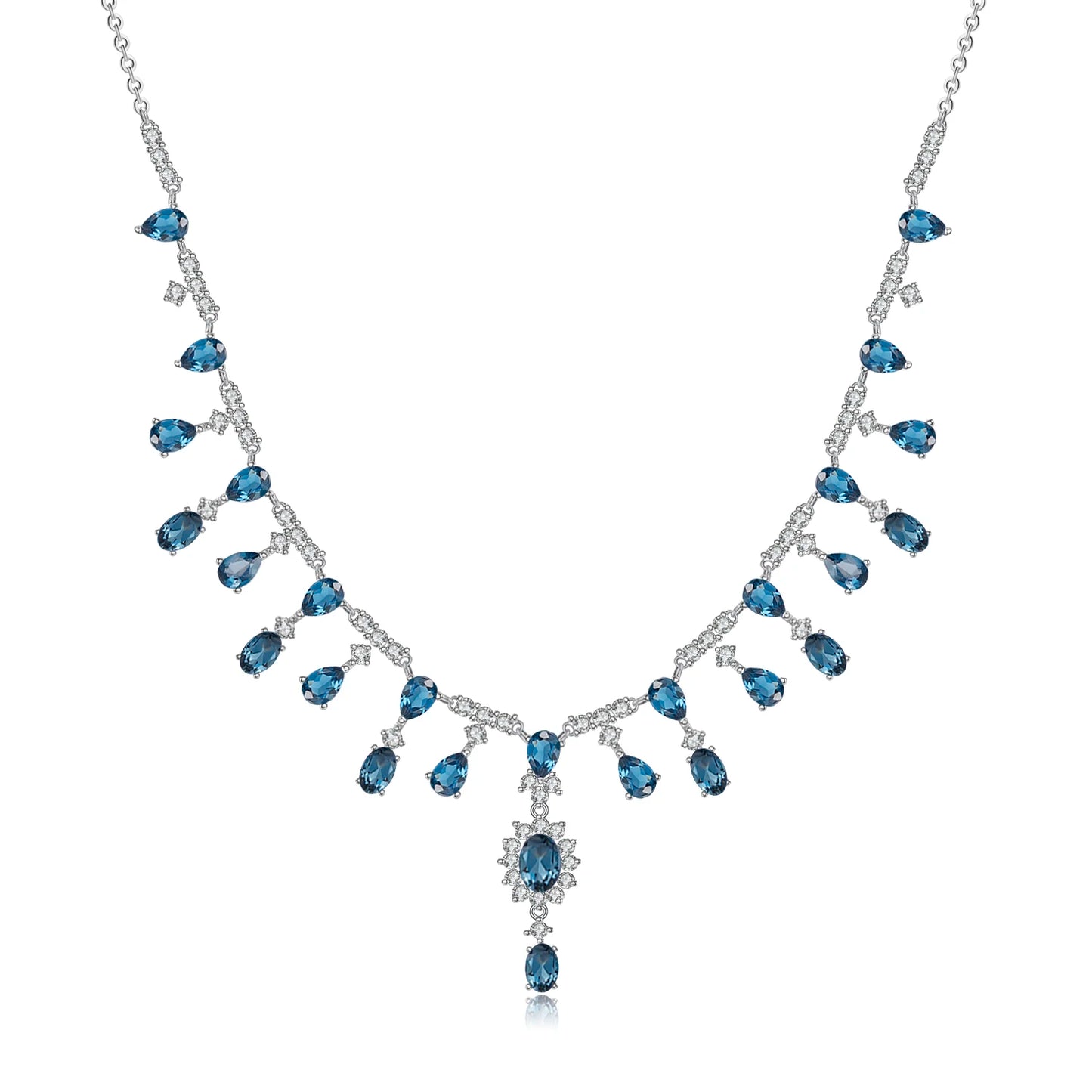 A silver necklace featuring green garnet stones set in an oval pattern with additional small white stones on a link chain.