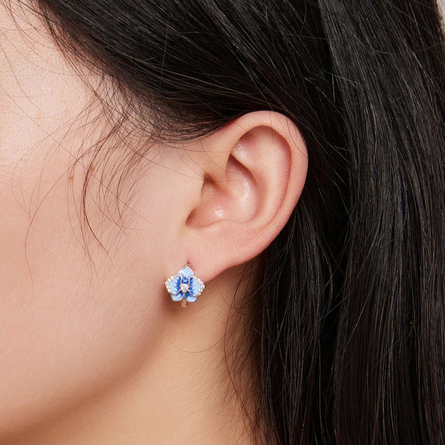 Sterling silver hoop earrings with blue enamel orchid flowers and crystal accents

