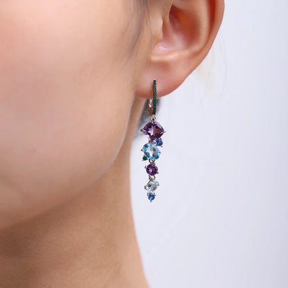 Dangling earrings with gradient blue and green stones set in silver

