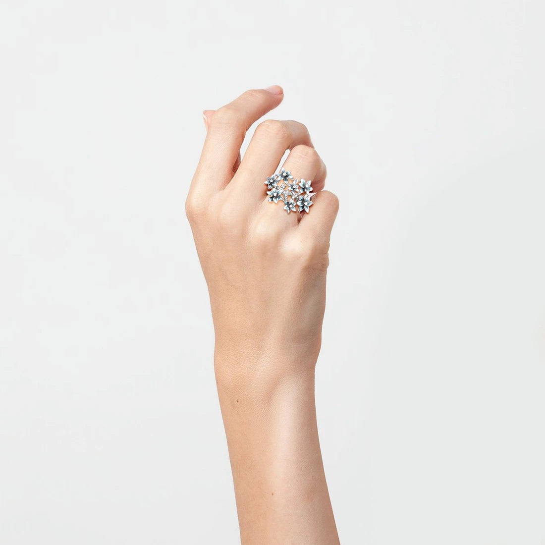 Silver ring with blue and white enamel hydrangea flowers and sparkling stones

