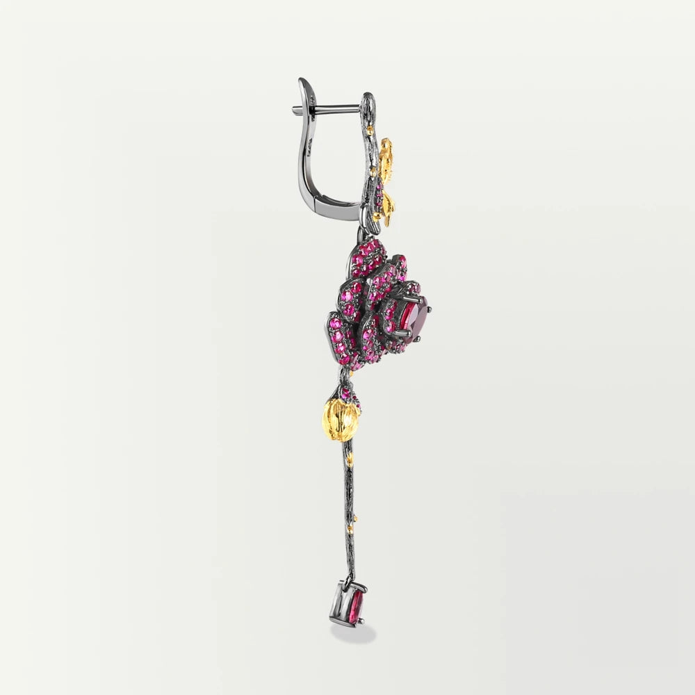 Long black rose earrings with red gemstones, gold leaves, and bud details from the Rossa Collection.

