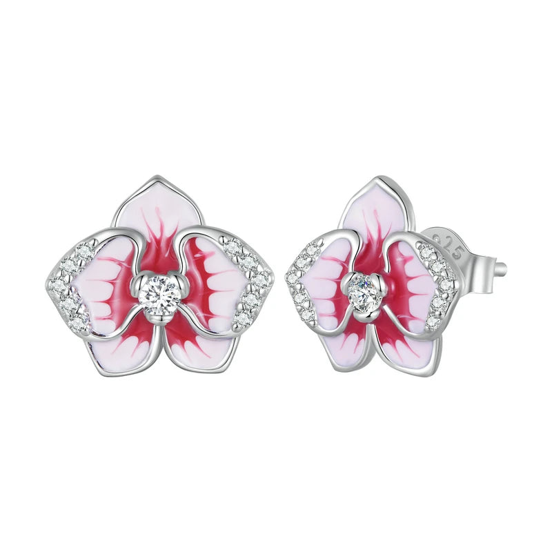 Silver orchid-shaped stud earrings with red and white enamel petals and central white stones

