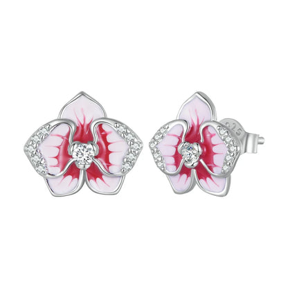 Silver orchid-shaped stud earrings with red and white enamel petals and central white stones


