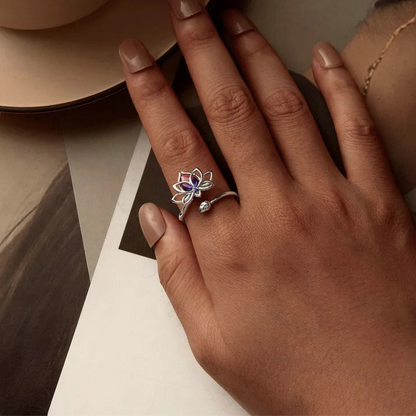 Sterling silver lotus flower ring with pink and blue gradient gemstone and small blue accent stone

