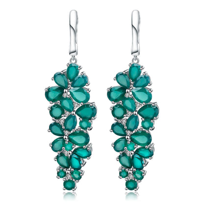Dangling silver earrings with clustered green teardrop stones arranged in a cascading floral pattern

