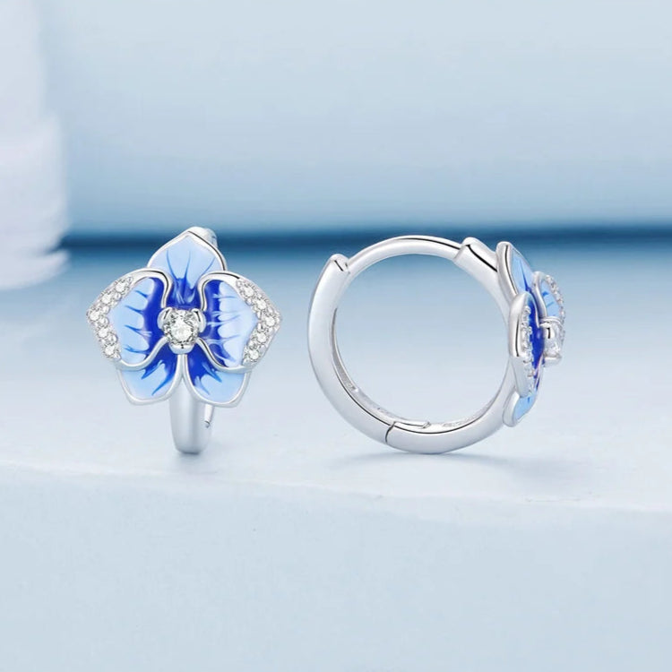 Sterling silver hoop earrings with blue enamel orchid flowers and crystal accents

