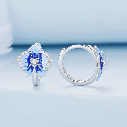 Sterling silver hoop earrings with blue enamel orchid flowers and crystal accents

